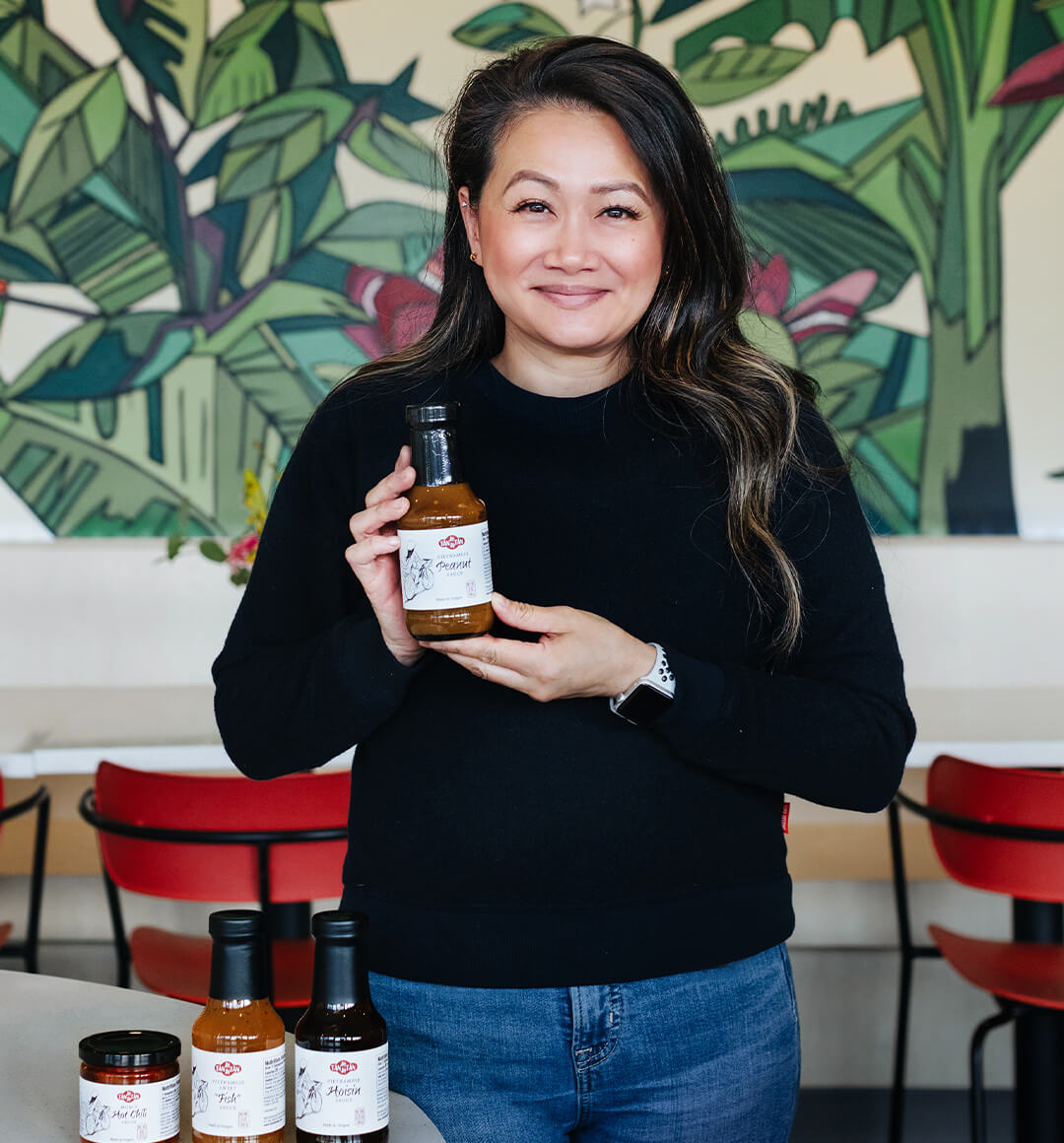 Lisa Tran, co-owner of Tân Tân Café with her signature sauces. 